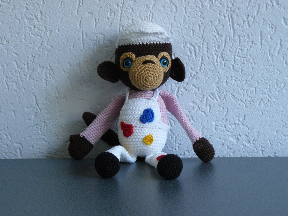 Leuke aap met verfvlekken